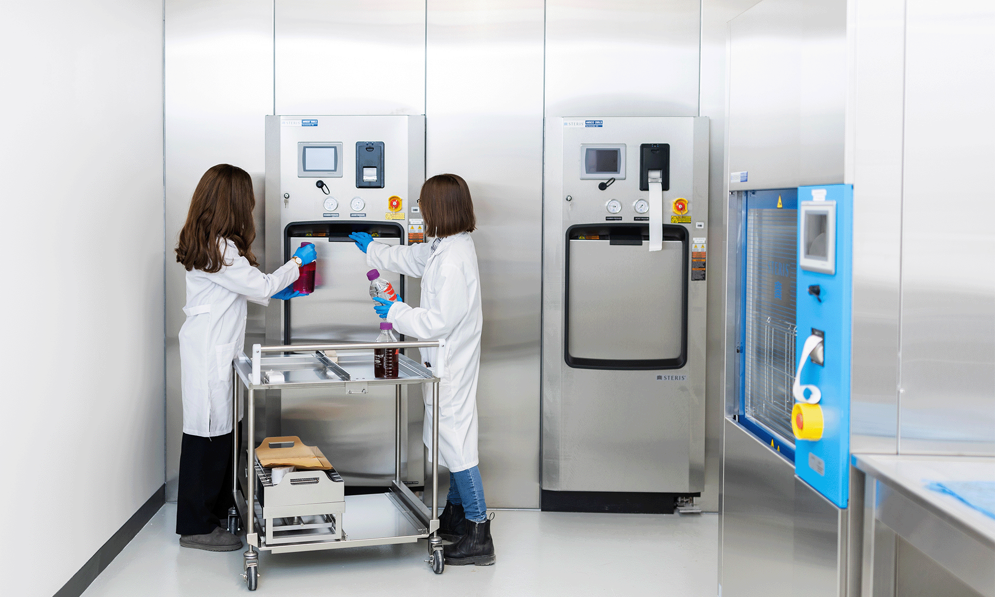 Two student researchers work in the SpinUp lab